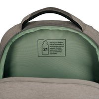 Close-up of the inside of a gray backpack showing a sage green lined interior with a printed '21' recycled material label.