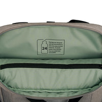 Open view of a gray and sage green backpack showing the interior lining and a printed recycling label inside the top compartment.