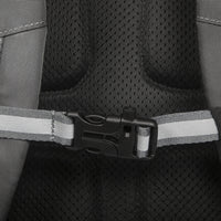 Close-up of a car seat belt buckle on a black car seat with gray straps.